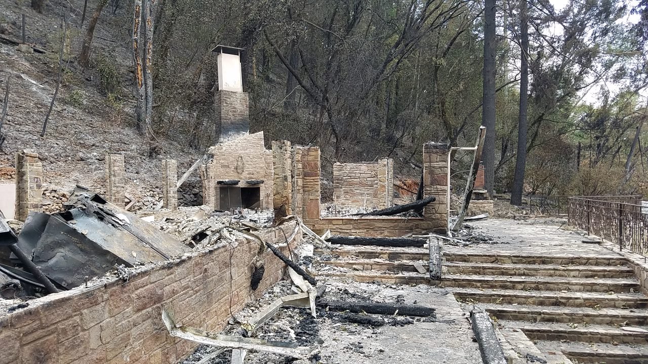 Burned outdoor patio with charred debris
